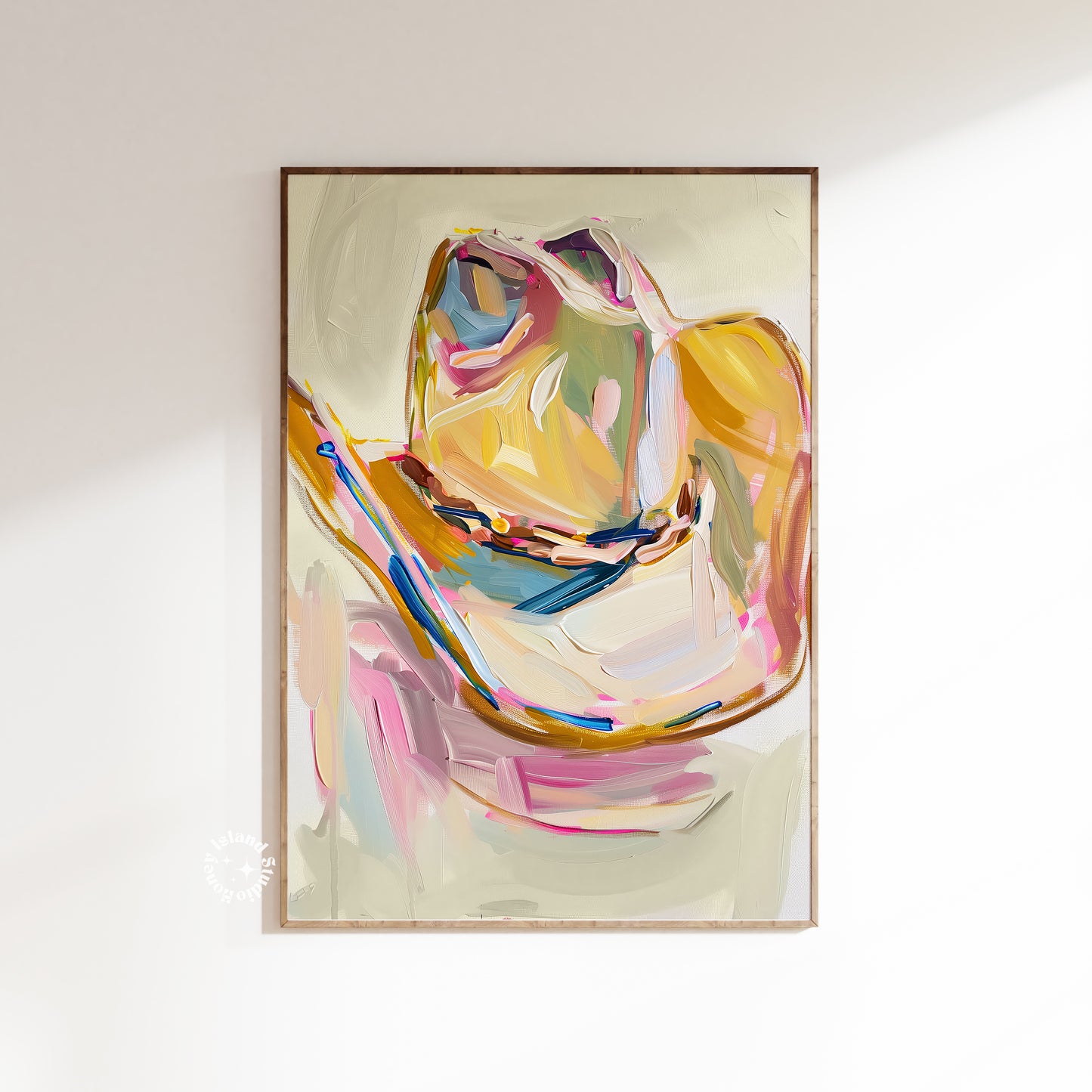 Cowgirl hat art painting in a wooden frame on a white wall
