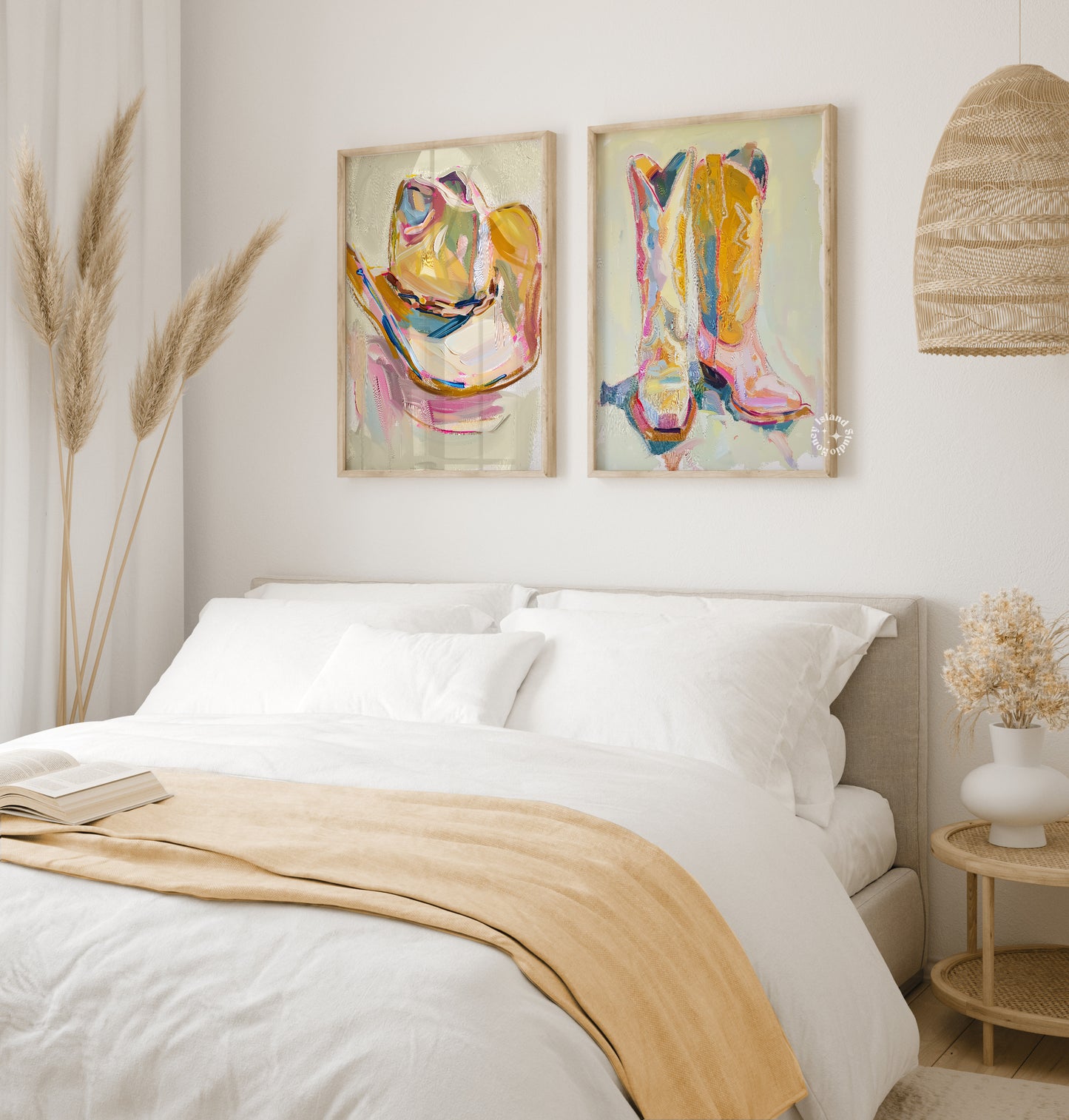 Bedroom with cowgirl art on the wall and a beige blanket on the bed.