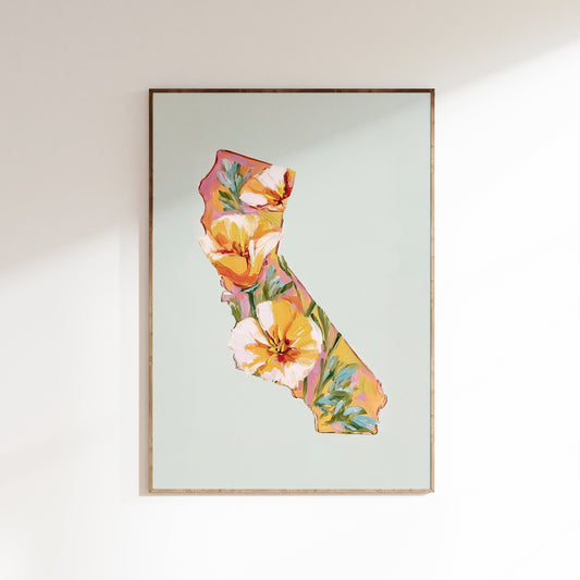 Framed artwork of a floral design in the shape of California on a light background