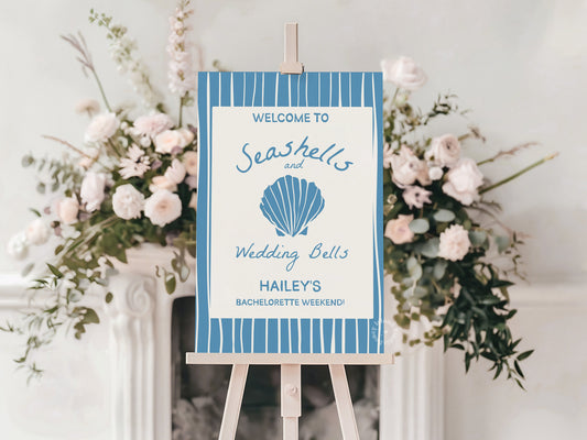 Decorative sign on an easel with floral arrangements on a white background