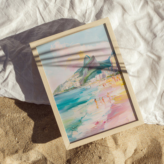 Framed artwork of a coastal scene on a sandy surface