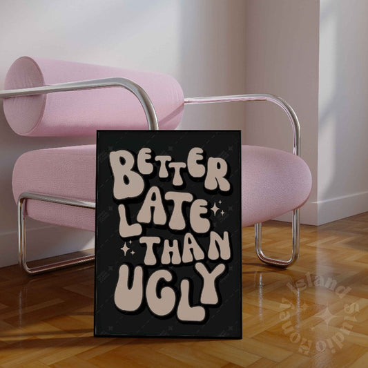 better_late_than_ugly_black_framed print next to pink chair