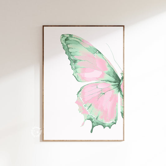Framed artwork of a pink and green butterfly on a white background