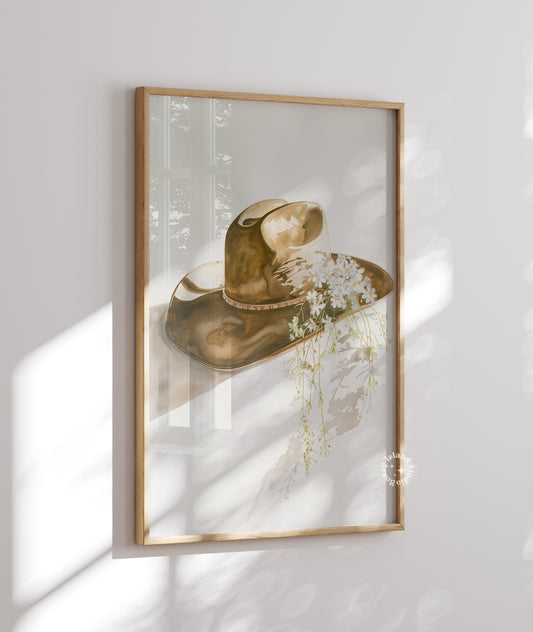 Framed artwork of a hat with flowers on a white wall