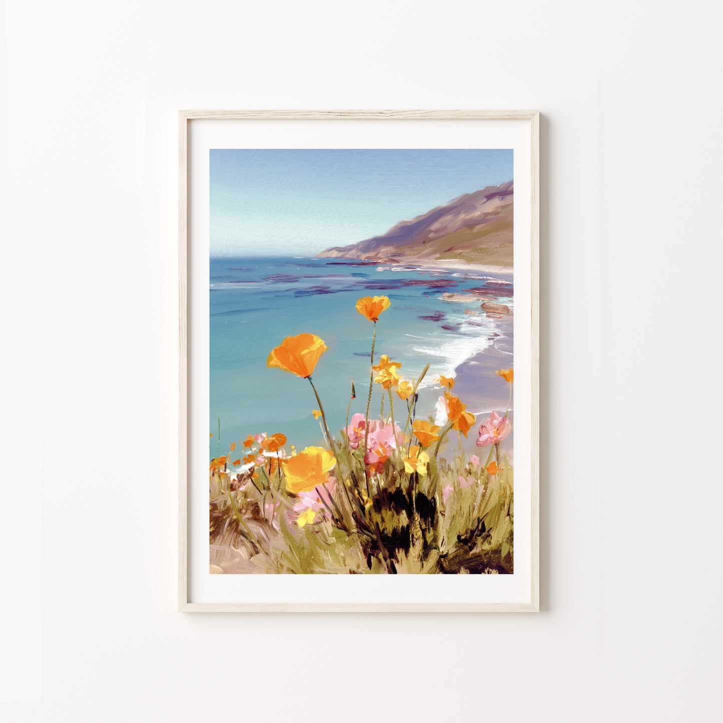 Framed artwork of a coastal scene with flowers on a white wall