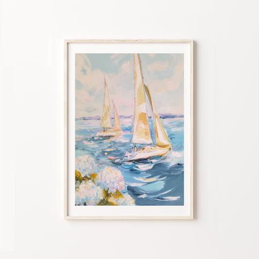 Framed artwork of sailboats on water with flowers at the bottom on a white wall.