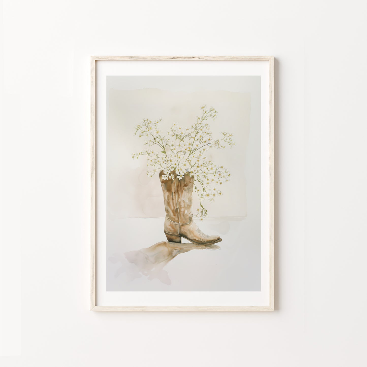 Framed artwork of a cowboy boot with flowers on a white background