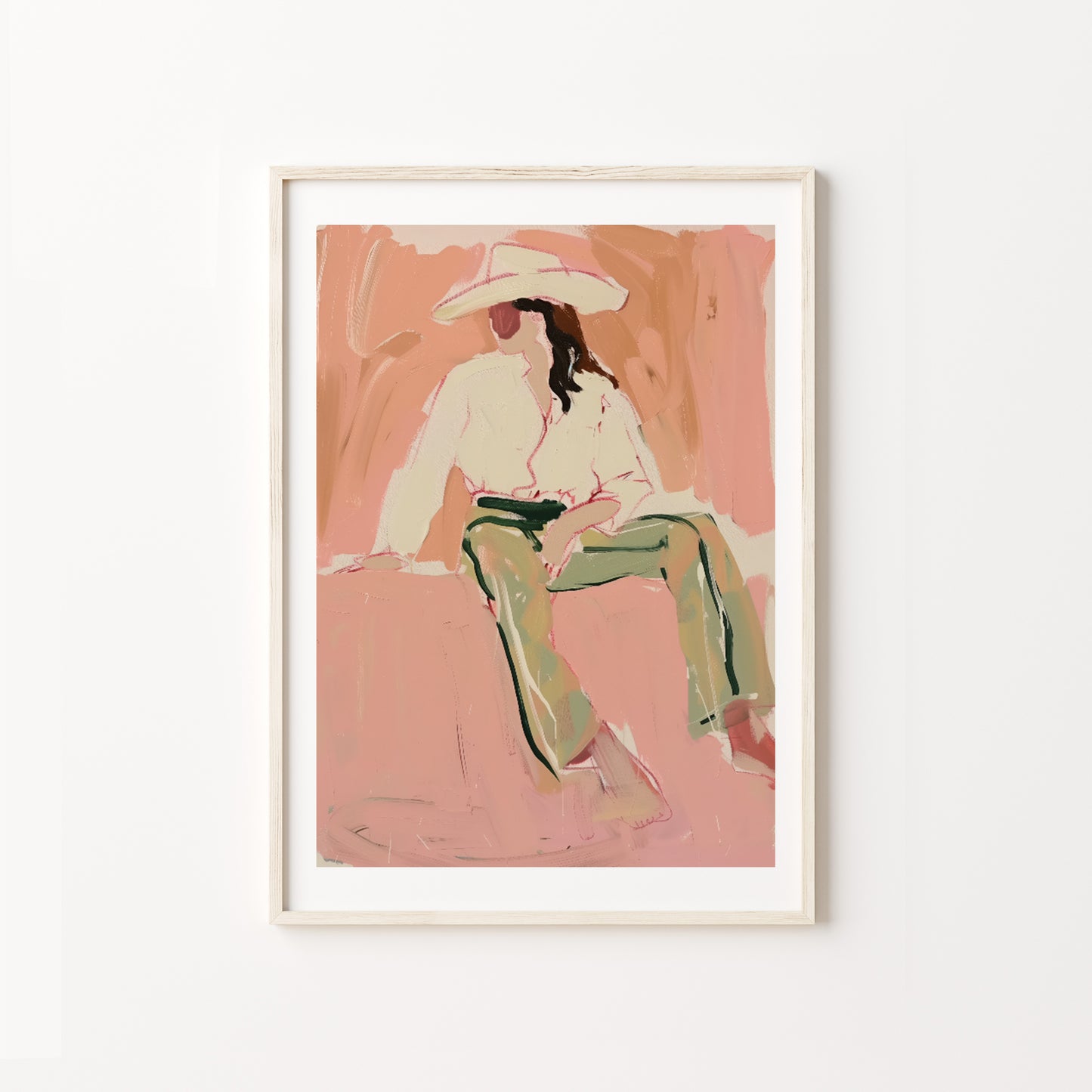 Framed artwork of a western woman cowgirl sitting on a pink background