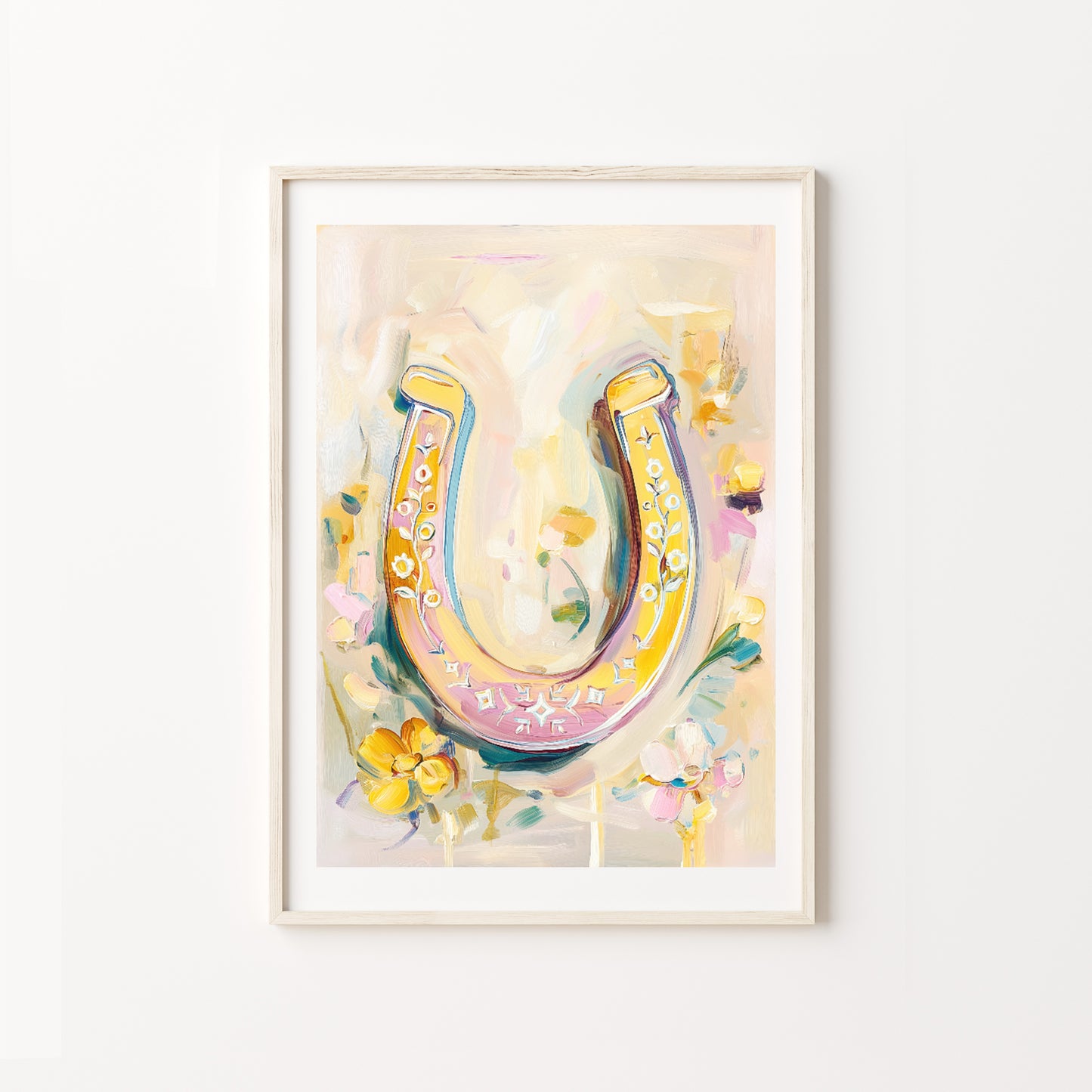 Colorful horseshoe artwork in a frame on a white wall