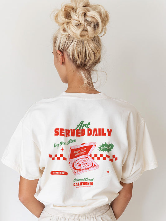 Model wearing a white t-shirt with a retro food graphic design on the back, featuring pizza and text.