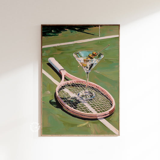 Framed artwork of a martini glass on a tennis racket with a tennis court background.