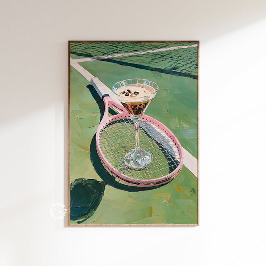 Framed artwork of a martini glass on a tennis racket with a tennis court background
