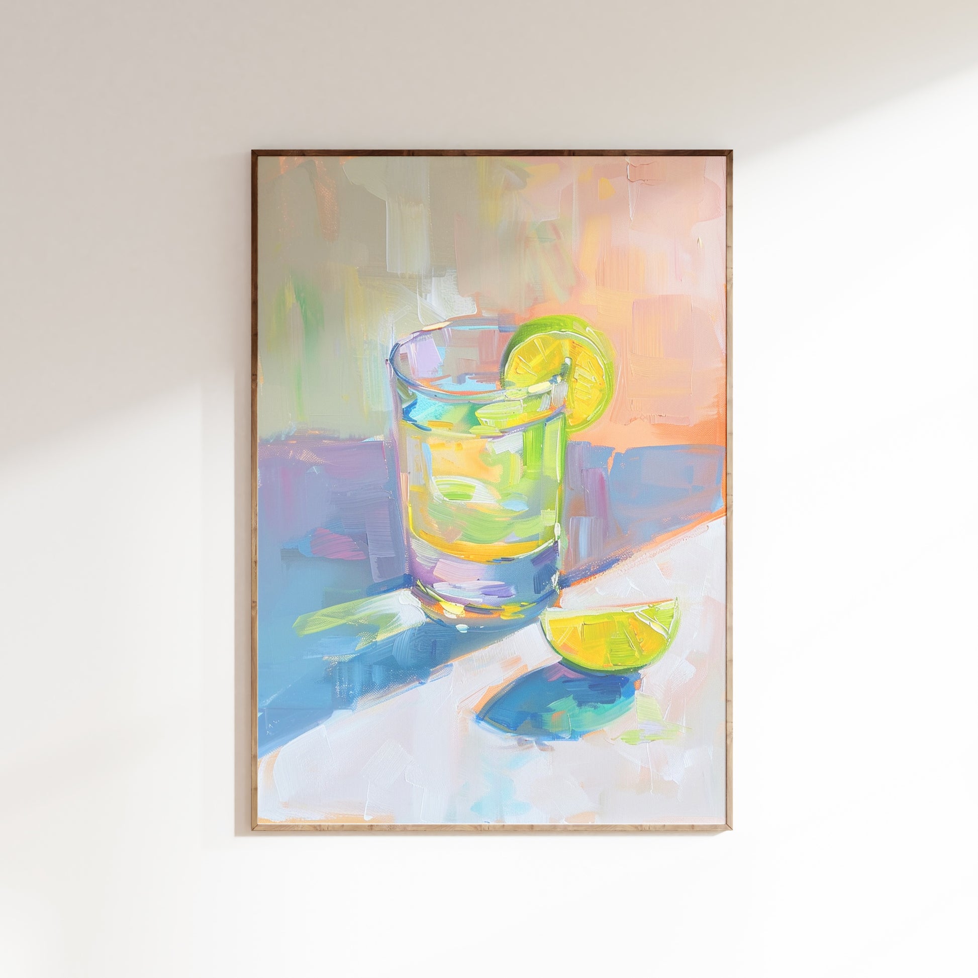 Framed painting of a glass with a lemon wedge on a white wall