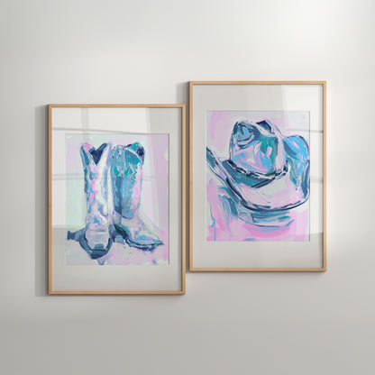 Two framed abstract art pieces of cowboy boots on a light gray wall.