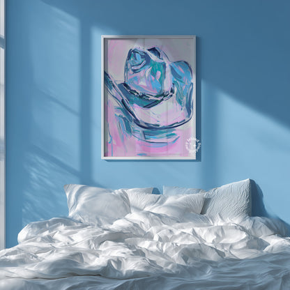 Framed abstract art of a rose on a blue wall above a bed with white bedding.