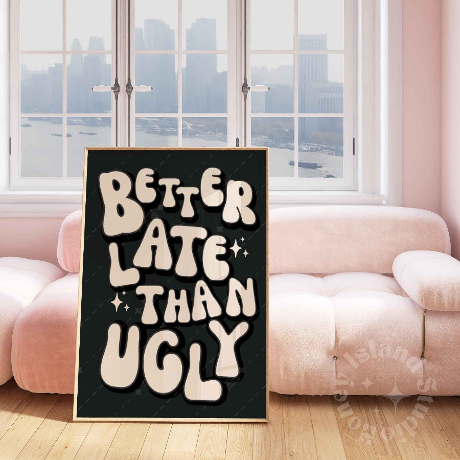 better late than ugly poster print framed next to a pink couch dorm decor