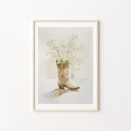 Framed artwork of a cowboy boot with flowers on a white background