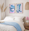 Bedroom with abstract art of cowboy boots on the wall
