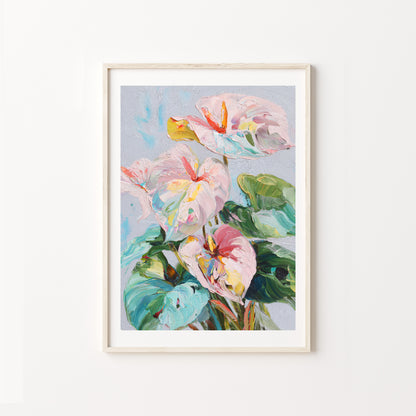 Framed artwork of colorful flowers on a white wall