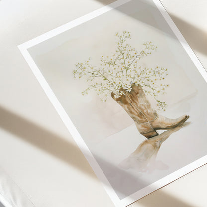 Art print of a boot with flowers on a white surface