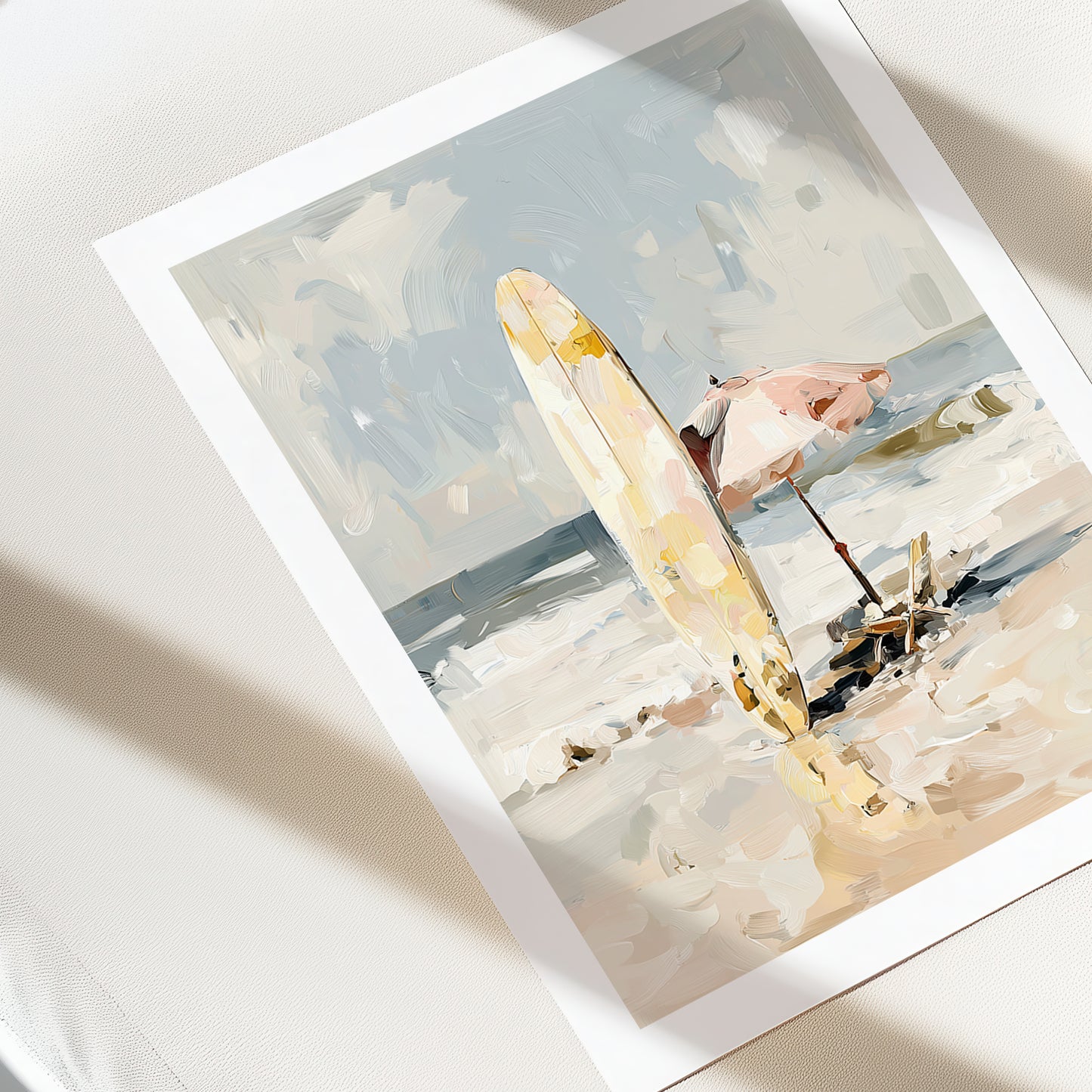 Art print of a beach scene with a surfboard and people on a white surface