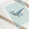 Illustration of a whale with floral patterns on a light blue background