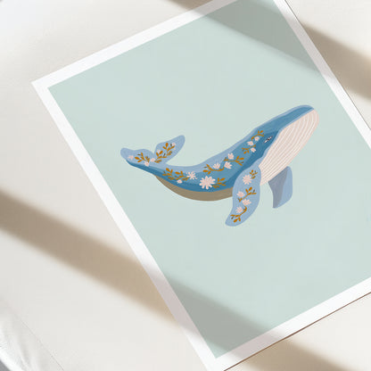 Illustration of a whale with floral patterns on a light blue background