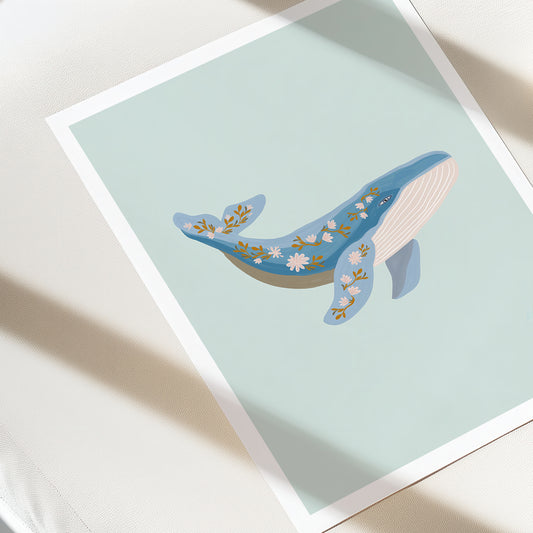 Illustration of a whale with floral patterns on a light blue background