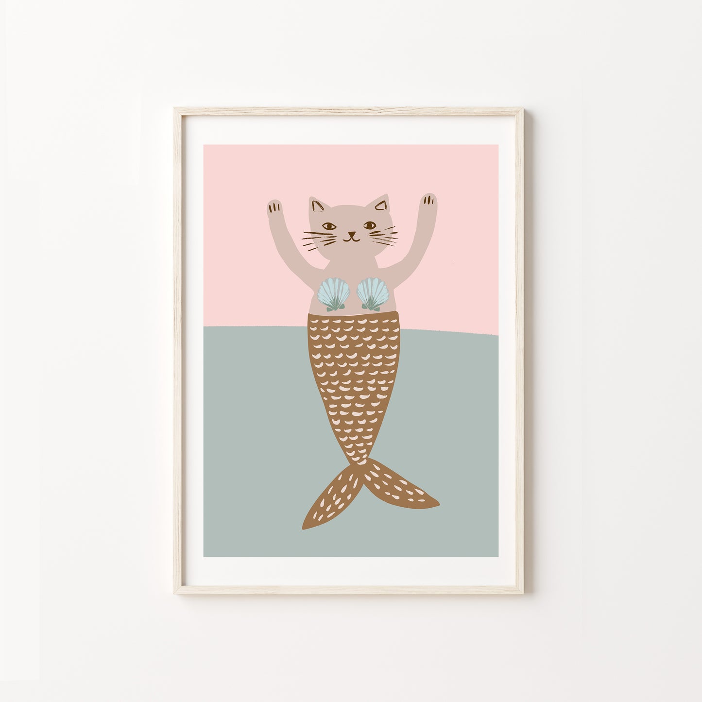 Framed artwork of a cat with a mermaid tail on a pink and blue background
