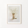 Framed artwork of a cowboy boot with flowers on a white background