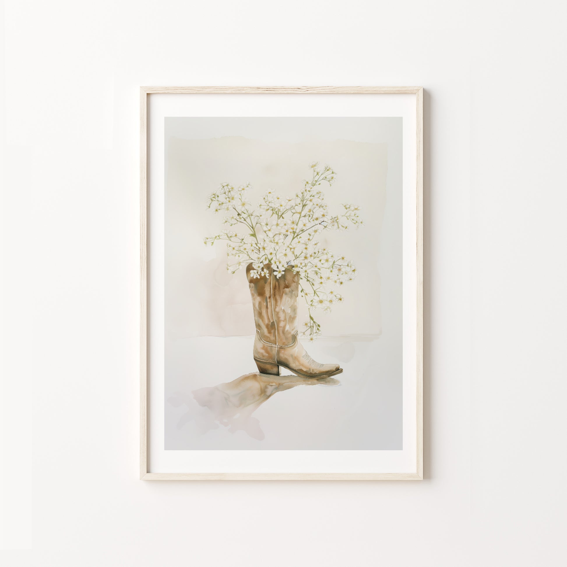 Framed artwork of a cowboy boot with flowers on a white background