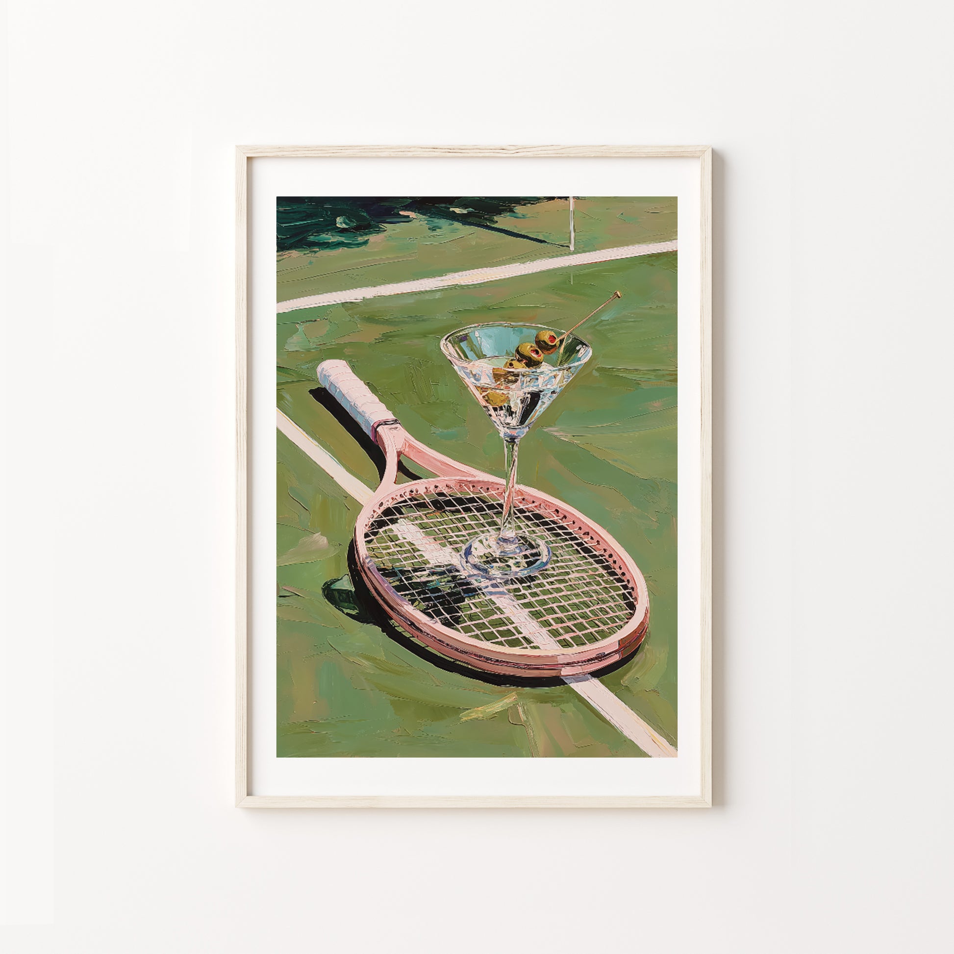 Framed artwork of a martini glass on a tennis racket on a tennis court.
