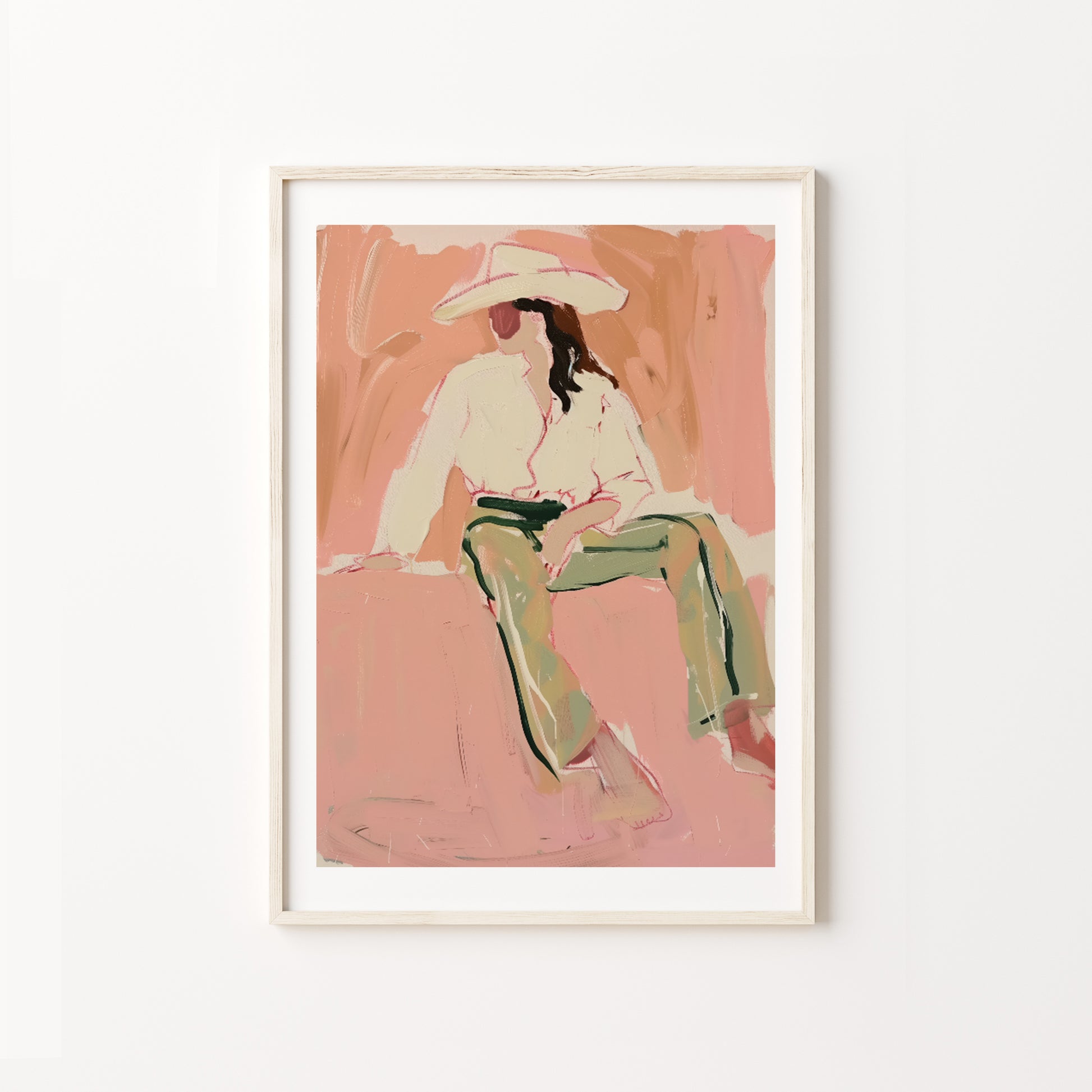 Framed artwork of a western woman cowgirl sitting on a pink background