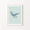 Framed artwork of a whale on a light blue background