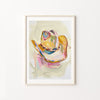 Framed abstract art print of a colorful cowboy hat on a white wall