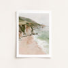 Framed artwork of a coastal landscape with cliffs and beach.