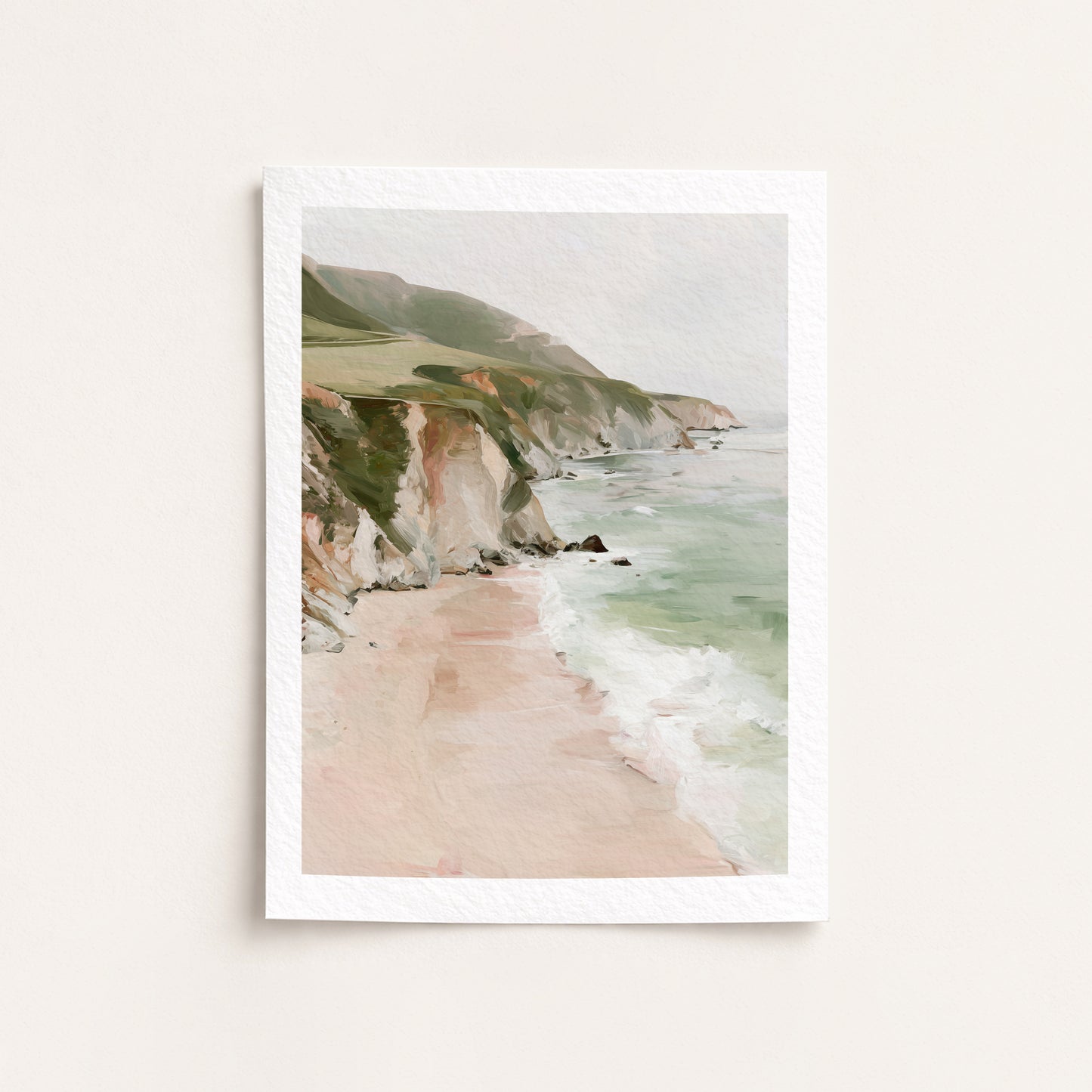 Framed artwork of a coastal landscape with cliffs and beach.