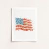 American flag made of small colorful flowers on a white background