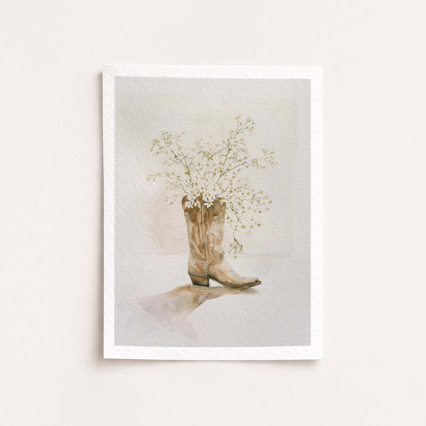 Framed artwork of a cowboy boot with flowers on a light background