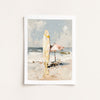 Framed artwork of a beach scene with a surfboard and umbrella on a white wall.