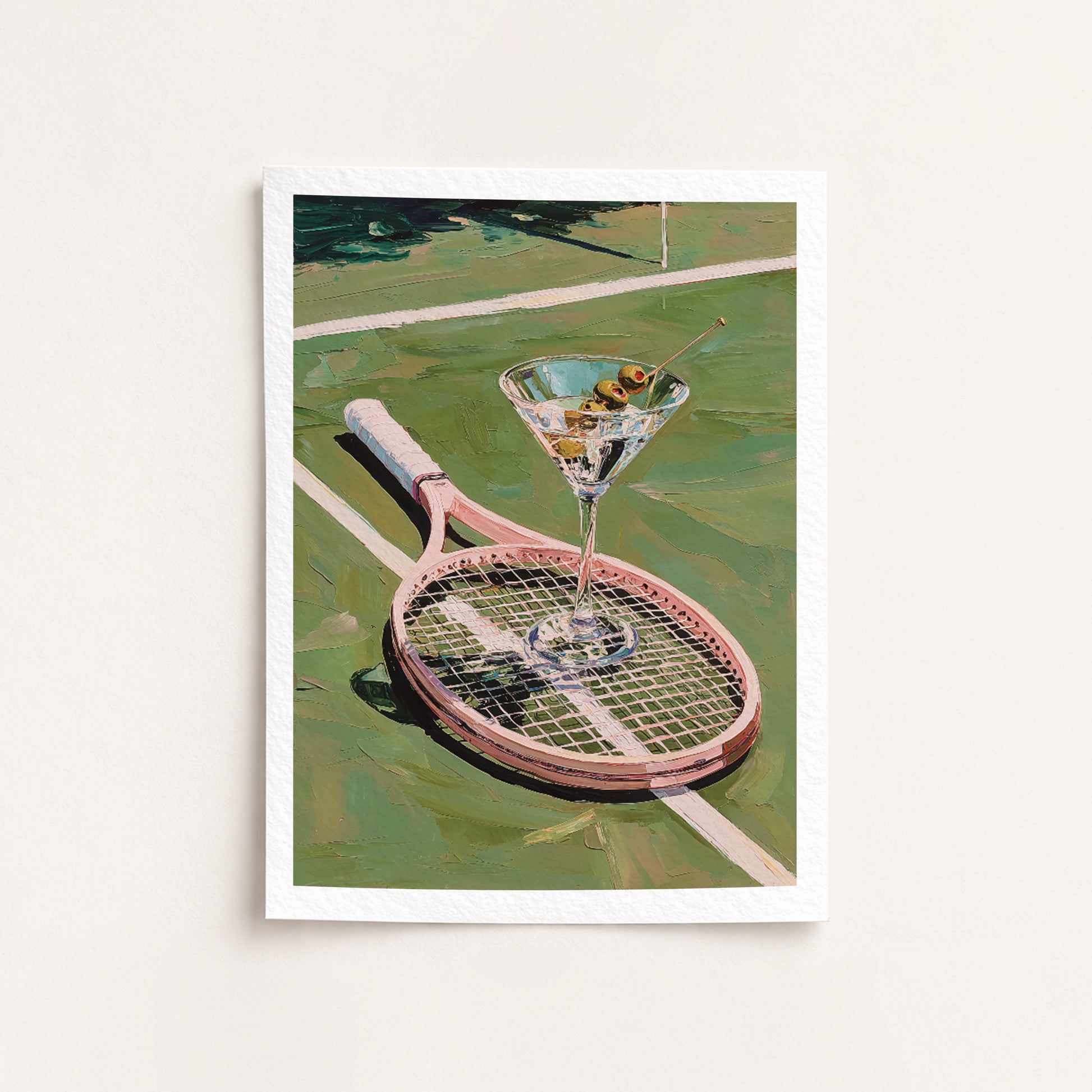 Framed artwork of a martini glass with olives on a tennis racket against a tennis court background.