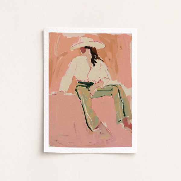Art print of a cowgirl sitting on a pink background