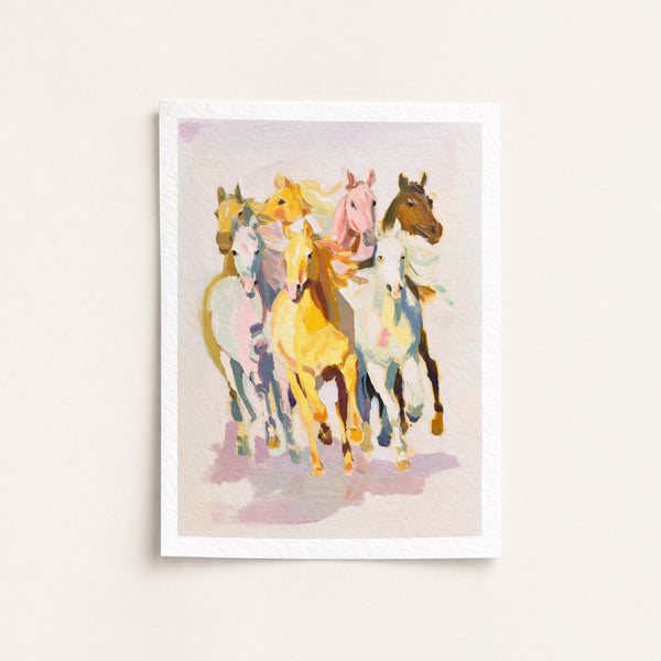Framed artwork of colorful horses on a light background