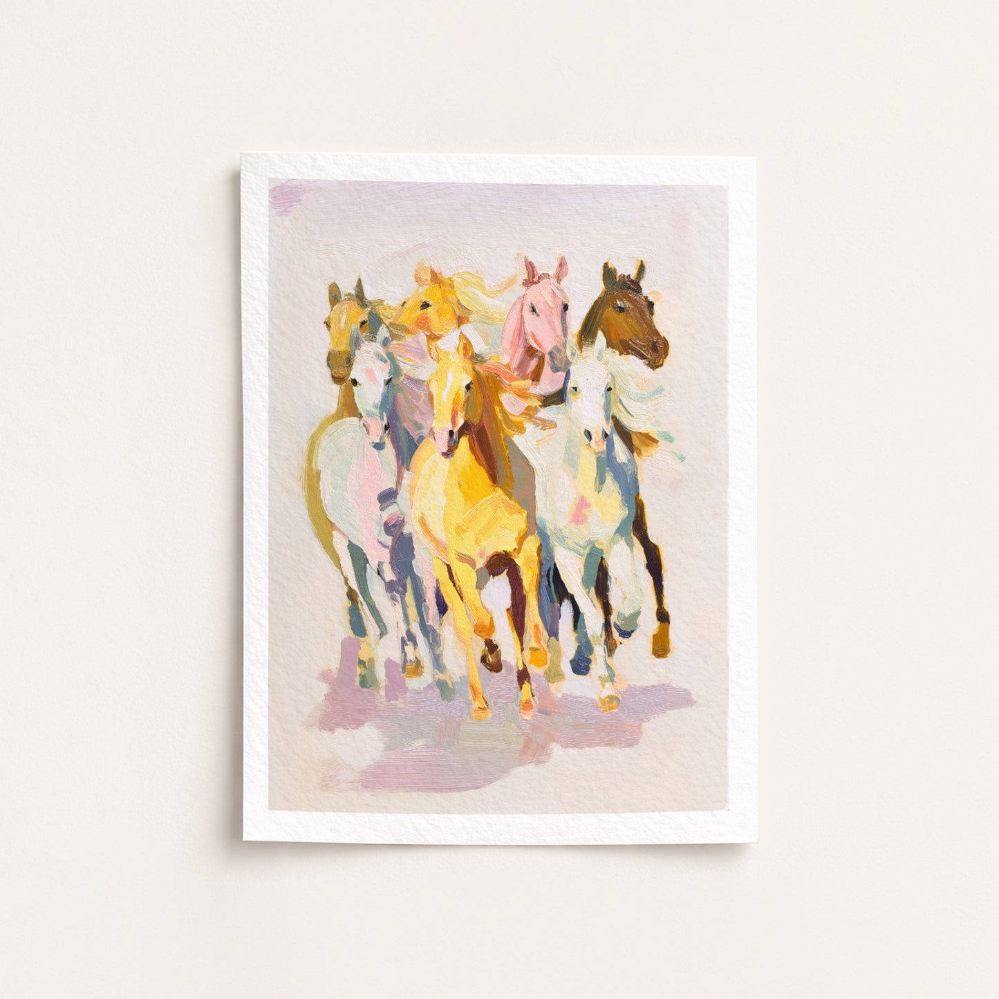 Framed artwork of colorful horses on a light background