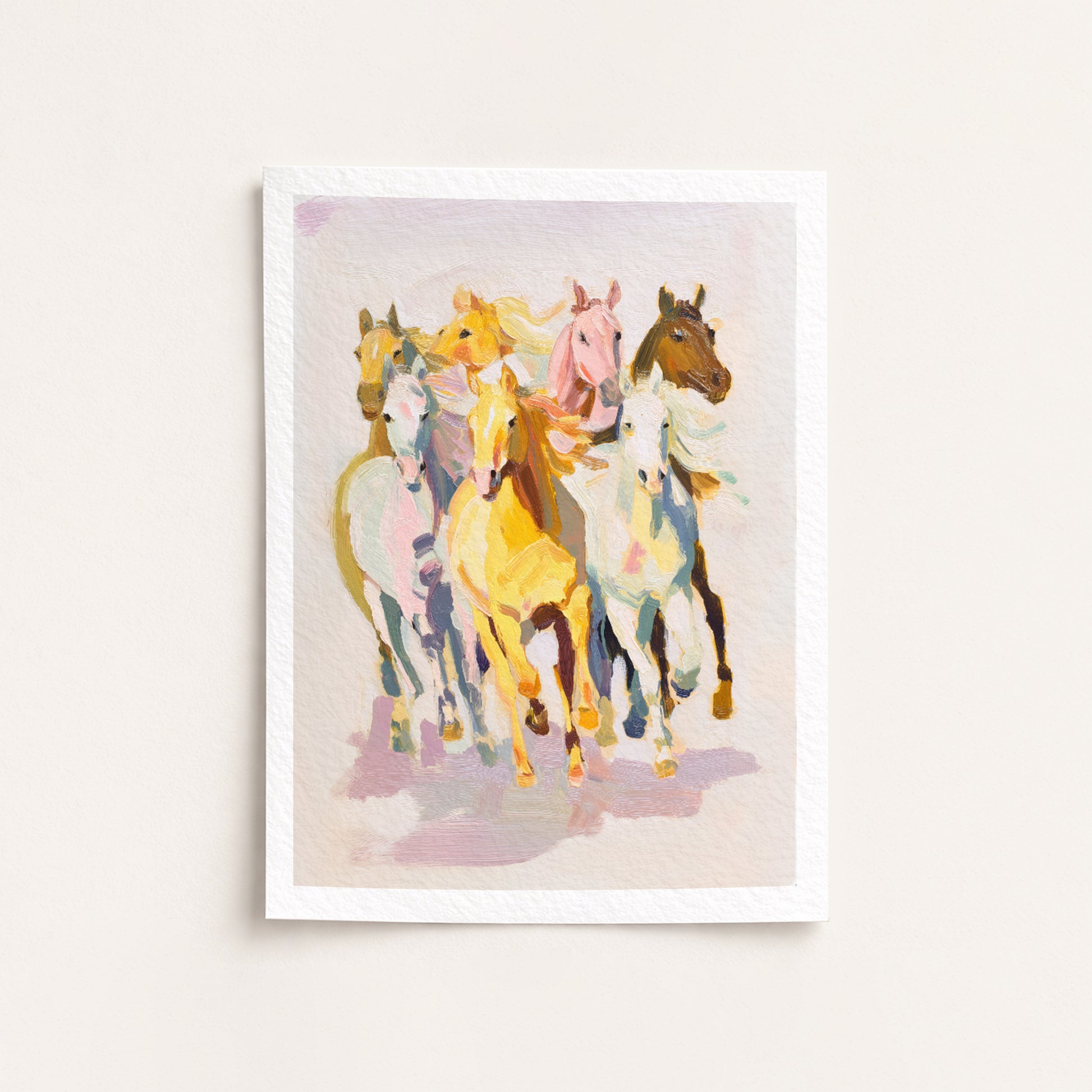 Framed artwork of colorful horses on a light background