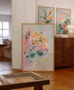 Colorful abstract tiger painting in a living room setting with floral artworks.