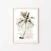 Framed artwork of a palm tree on a white wall
