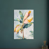 Canvas print of a colorful banana plant painting on a teal wall.