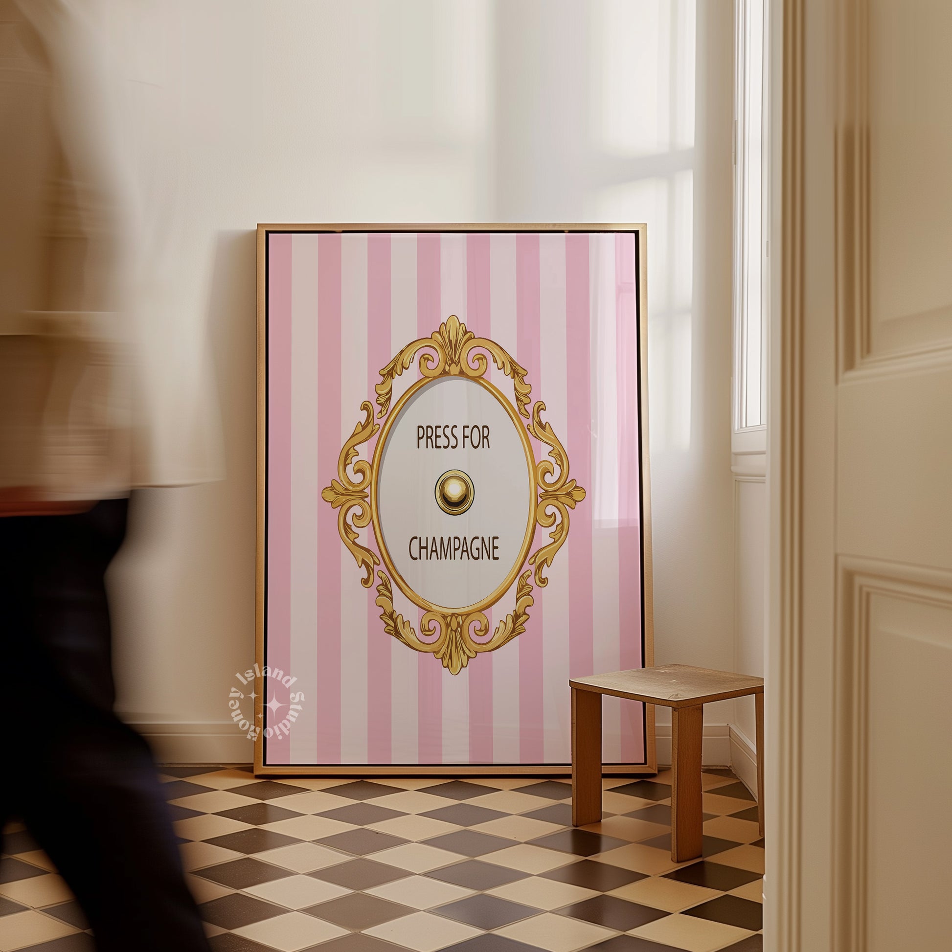 Decorative wall art with pink and white striped background and gold frame in a room.