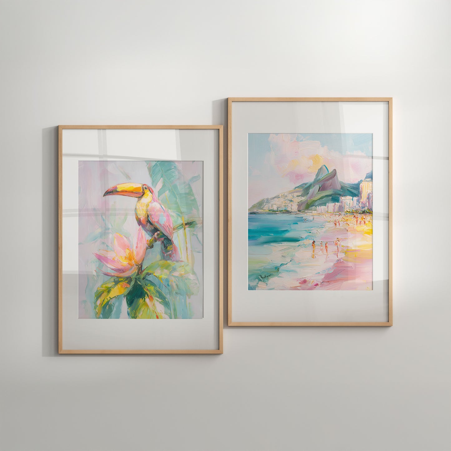Two framed artworks on a wall, one with a tropical scene and the other with a beach view.